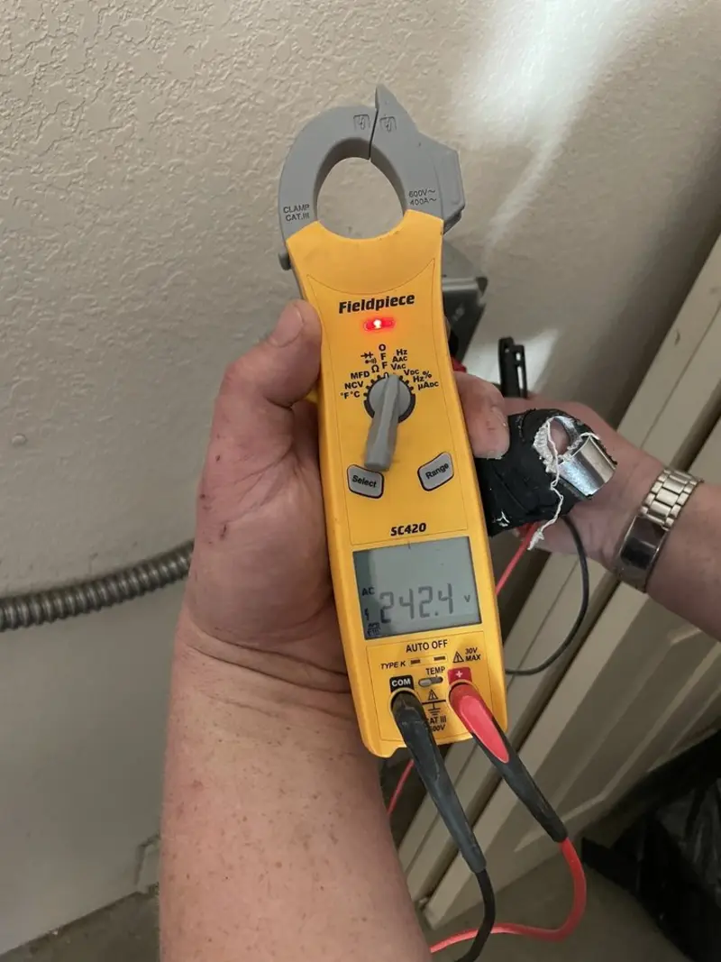 Voltage testing with clamp meter during Whole House Surge Protector in Niceville
